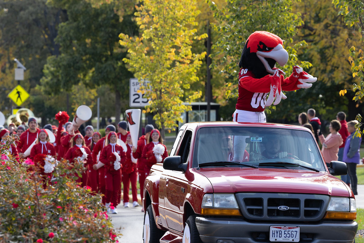 Swoop and the Miami cheerleaders welcoming the community during the Homecoming parade
